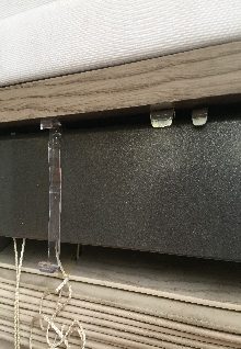 Bracket closed and the blind fixed in place