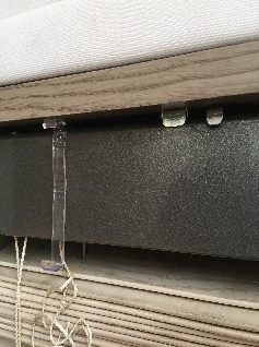 Bracket closed and the blind fixed in place